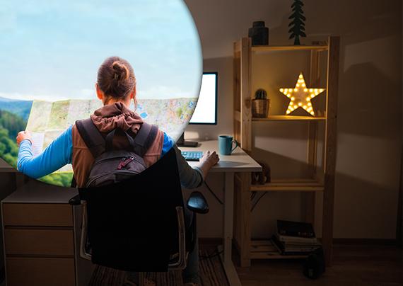 a girl is seen from behind sitting on a desk with a circle overlapping showing she is out side exploring at the same time. 